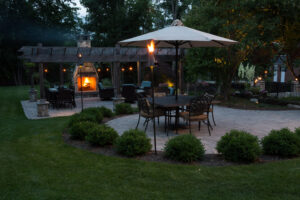 Outdoor Lighting with fireplace and tiki torches 