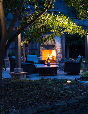 outdoor fireplace and fire pit design by Horizon Landscape