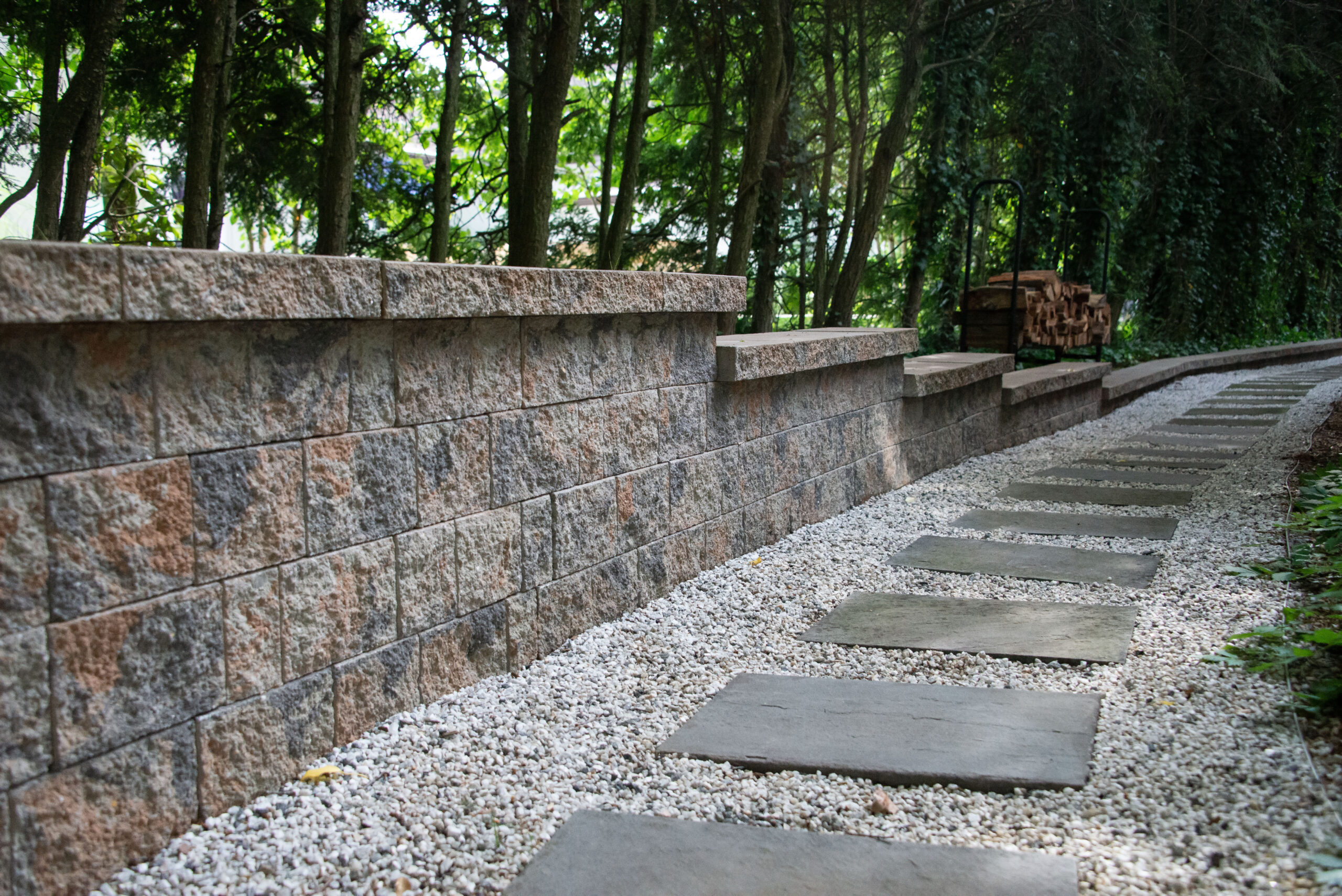 Retaining Wall and Bluestone Stepping Stone with Pea Gravel